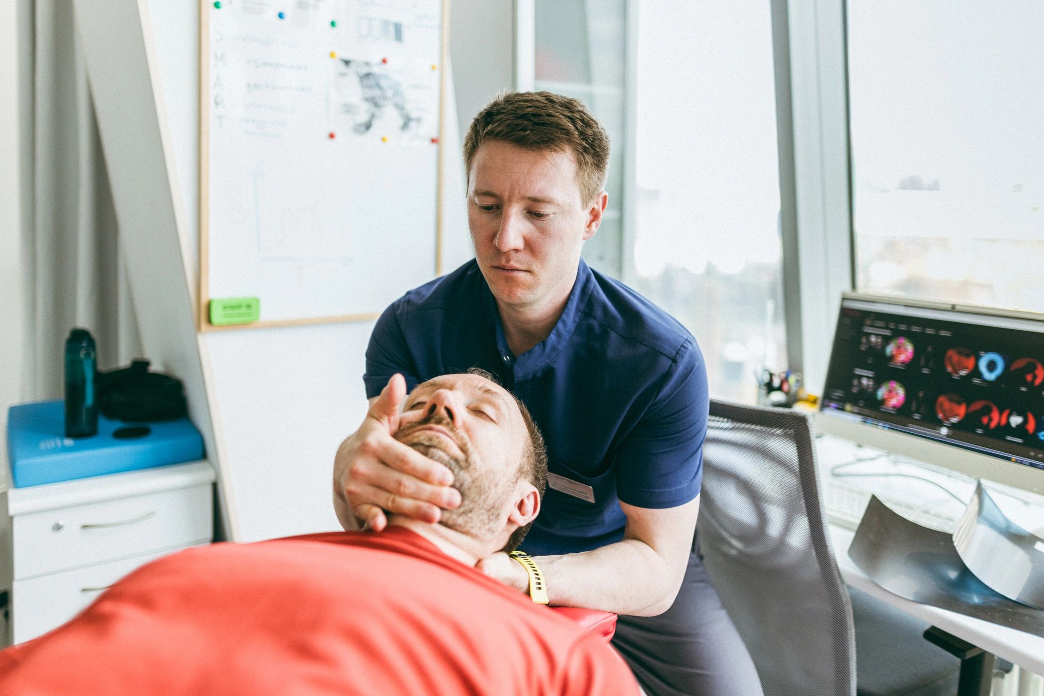 chiropractor with patient